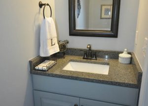 Powder room refresh with new flooring, vanity and paint